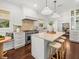 Modern kitchen with a large island, marble countertops, custom cabinets, and stainless steel appliances at 803 S Packwood Ave, Tampa, FL 33606