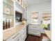 Elegant kitchen features custom cabinets, marble countertops, and a wine fridge at 803 S Packwood Ave, Tampa, FL 33606