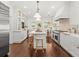 Spacious kitchen featuring stainless steel appliances, a large island, and custom cabinetry at 803 S Packwood Ave, Tampa, FL 33606
