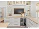 Elegant kitchen with custom cabinets, a wine fridge and marble countertops at 803 S Packwood Ave, Tampa, FL 33606