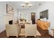 Inviting living room featuring hardwood floors, a modern fireplace, and stylish furnishings at 803 S Packwood Ave, Tampa, FL 33606