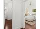 Walk-in closet leads to a well-lit main bedroom with a ceiling fan at 803 S Packwood Ave, Tampa, FL 33606