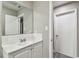 Bathroom featuring white vanity and subway tile backsplash at 803 W Warren St, Plant City, FL 33563