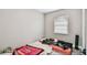 Bedroom with a window and gray wood-look vinyl flooring at 803 W Warren St, Plant City, FL 33563