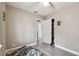 Bedroom with a window, closet, and gray wood-look vinyl flooring at 803 W Warren St, Plant City, FL 33563