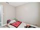 Bedroom with a window and gray wood-look vinyl flooring at 803 W Warren St, Plant City, FL 33563