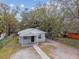 Charming exterior view of the home showcasing its updated facade and landscaping at 803 W Warren St, Plant City, FL 33563