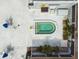Aerial view of the spa area surrounded by greenery and lounge chairs at 8220 112Th N St # 206, Seminole, FL 33772