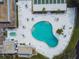 Overhead view of the community pool, showcasing a unique shape and ample lounging space at 8220 112Th N St # 206, Seminole, FL 33772