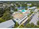 Aerial shot featuring the community center, pool, and lake surrounded by lush greenery at 8220 112Th N St # 206, Seminole, FL 33772