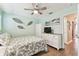 Cozy bedroom with a tropical theme, featuring a leaf decor, and dresser at 8220 112Th N St # 206, Seminole, FL 33772