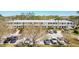 Condominium building featuring a well-kept exterior, landscaped grounds and ample parking at 8220 112Th N St # 206, Seminole, FL 33772