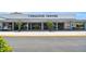 Community clubhouse entrance with well-maintained landscaping, easy access, and designated parking spots at 8220 112Th N St # 206, Seminole, FL 33772