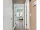 Hallway view leading into a bedroom with bright accents and natural light at 8220 112Th N St # 206, Seminole, FL 33772
