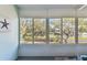 Light-filled sunroom with large windows showcases outdoor views and serene backyard at 8220 112Th N St # 206, Seminole, FL 33772