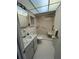 Bright bathroom with tiled floors, walk-in shower, and accessible handrails at 8402 111Th St # 303, Seminole, FL 33772