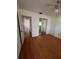 Bedroom with laminate flooring, mirrored closet and neutral paint at 8402 111Th St # 303, Seminole, FL 33772