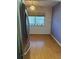 Open dining area featuring laminate flooring and natural light from the large window at 8402 111Th St # 303, Seminole, FL 33772