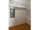 Walk-in closet with white shelving and laminate flooring at 8402 111Th St # 303, Seminole, FL 33772