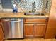 Updated kitchen with stainless steel appliances, modern backsplash and granite countertops at 880 Mandalay Ave # N802, Clearwater Beach, FL 33767