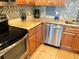 Updated kitchen with stainless steel appliances, modern backsplash and granite countertops at 880 Mandalay Ave # N802, Clearwater Beach, FL 33767