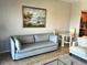 Living space boasts a comfortable sofa and adjacent dining and kitchen areas at 880 Mandalay Ave # N802, Clearwater Beach, FL 33767
