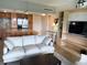 Comfortable living room featuring an open floor plan, and a tv with built-ins at 880 Mandalay Ave # N802, Clearwater Beach, FL 33767
