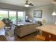 Living room features stylish furnishings and direct access to the private balcony at 880 Mandalay Ave # N802, Clearwater Beach, FL 33767