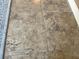 Close-up of a neutral colored tile floor with tiny pebbles embedded throughout at 880 Mandalay Ave # N802, Clearwater Beach, FL 33767