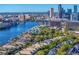 An elevated view of lush homes along the Hillsborough River, with the downtown Tampa skyline in the background at 926 Anchorage Rd, Tampa, FL 33602