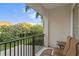 Balcony features seating and a view of lush greenery, palm trees, and blue sky at 926 Anchorage Rd, Tampa, FL 33602