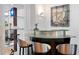 Elegant bar area with glass shelving, modern lighting, and sleek stools at 926 Anchorage Rd, Tampa, FL 33602
