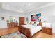Cozy bedroom with hardwood floors, tray ceilings, and an accent wall art piece create a welcoming atmosphere at 926 Anchorage Rd, Tampa, FL 33602
