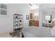 Inviting bedroom featuring a wet bar and mini fridge, ample natural light, and tiled floors at 926 Anchorage Rd, Tampa, FL 33602