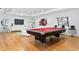 Bright game room features a pool table, hardwood floors, modern decor, and recessed lighting at 926 Anchorage Rd, Tampa, FL 33602