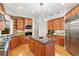 The kitchen features wood cabinets, granite countertops, a large center island, and stainless appliances at 926 Anchorage Rd, Tampa, FL 33602