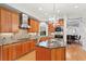 Kitchen with granite countertops, custom cabinets, stainless appliances, and view of exterior foliage at 926 Anchorage Rd, Tampa, FL 33602