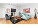 Bright living room with hardwood floors, modern decor and unique art at 926 Anchorage Rd, Tampa, FL 33602