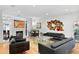 Open living room with modern decor, fireplace, bar, and hardwood floors at 926 Anchorage Rd, Tampa, FL 33602