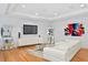 Elegant living room features hardwood floors, recessed lighting, and sleek, modern furniture at 926 Anchorage Rd, Tampa, FL 33602