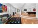 Spacious living room boasts wood floors, modern furniture, and plenty of natural light at 926 Anchorage Rd, Tampa, FL 33602
