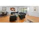 Spacious living room with modern decor, hardwood floors, and plenty of natural light at 926 Anchorage Rd, Tampa, FL 33602