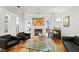 Well-lit living room featuring a fireplace, bar, and contemporary glass coffee table at 926 Anchorage Rd, Tampa, FL 33602