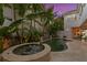 Backyard pool and hot tub surrounded by lush tropical landscaping at 926 Anchorage Rd, Tampa, FL 33602