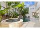Beautiful backyard pool and hot tub surrounded by tropical landscaping at 926 Anchorage Rd, Tampa, FL 33602