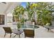 Private backyard pool area featuring a waterfall feature, lounge chairs, and tropical landscaping at 926 Anchorage Rd, Tampa, FL 33602