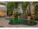 Tranquil pool featuring a serene waterfall and lush tropical landscaping with a built in spa at 926 Anchorage Rd, Tampa, FL 33602