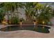 This pool has lush tropical landscaping and a stone water feature at 926 Anchorage Rd, Tampa, FL 33602