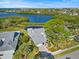 Beautiful waterfront home with mature trees and water views at 1020 Lake Avoca Dr, Tarpon Springs, FL 34689