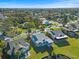 Residential neighborhood showcasing lush landscaping and scenic views at 1020 Lake Avoca Dr, Tarpon Springs, FL 34689